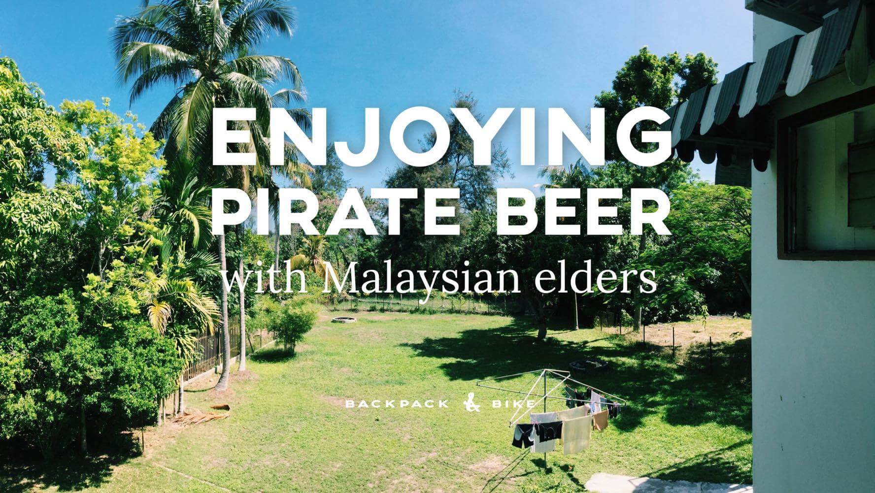 Enjoying Pirate Beer with Malaysian elders
